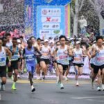 Runners participate in the 2026 Zhengzhou Marathon, which celebrates Chinese cultural heritage through poetry, traditional opera, kung fu and family surnames.