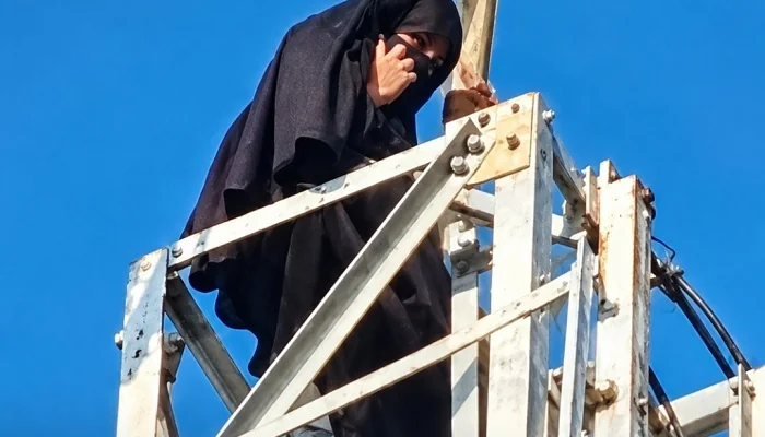 A 19-year-old woman reportedly climbs a 100-foot mobile tower in Uttar Pradesh before coming down after an online nikah.