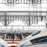 Passengers board a high-speed train in China as railway travel reaches a record 3.71 billion trips during the first nine months of 2026.