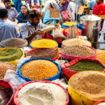 Essential commodities including flour, eggs, chicken and LPG being sold above official government prices in Karachi markets on October 23, 2026.