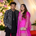 Munawar Faruqui arrives at Mr Faisu's wedding reception with his wife.