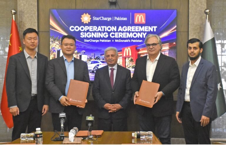 Federal Minister Rana Tanveer Hussain attends the StarCharge and McDonald’s Pakistan EV charging cooperation agreement ceremony in Islamabad on October 19, 2026, alongside Omar Malik and Jamil Mughal.