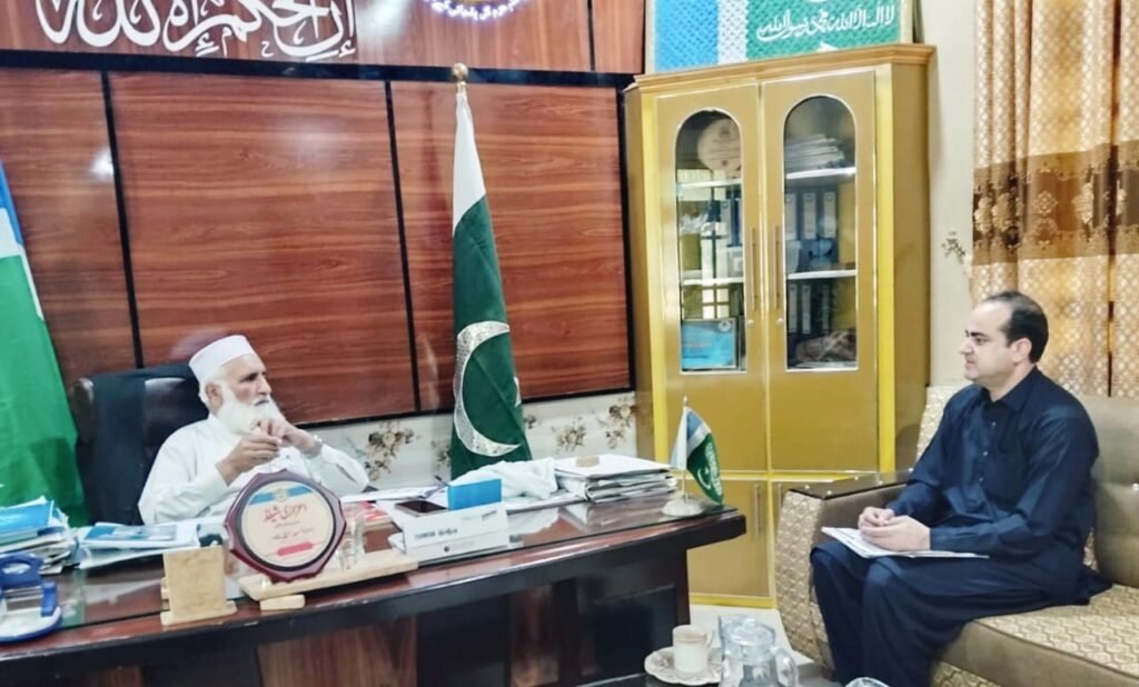 Lower Dir RTS District Monitoring Officer Zia-ur-Rehman meets Maulana Asadullah Khan to discuss public services.
