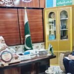 Lower Dir RTS District Monitoring Officer Zia-ur-Rehman meets Maulana Asadullah Khan to discuss public services.
