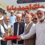Yousafzai community elders attend the Malik Ahmed Khan Baba Award Show in Lower Dir, where awards and traditional Pakol caps are presented.