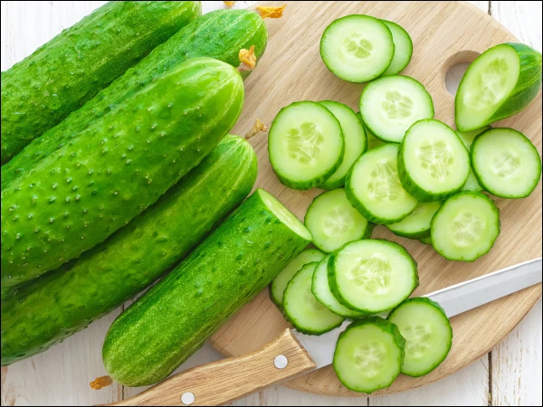 A Simple Cucumber Trick for Healthier Eating Crushed cucumber pieces prepared for a healthy, low-calorie salad.