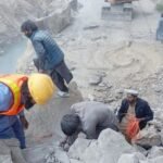 Landslide debris blocks Jaglot-Skardu Highway in Gilgit-Baltistan as heavy machinery works to restore traffic.
