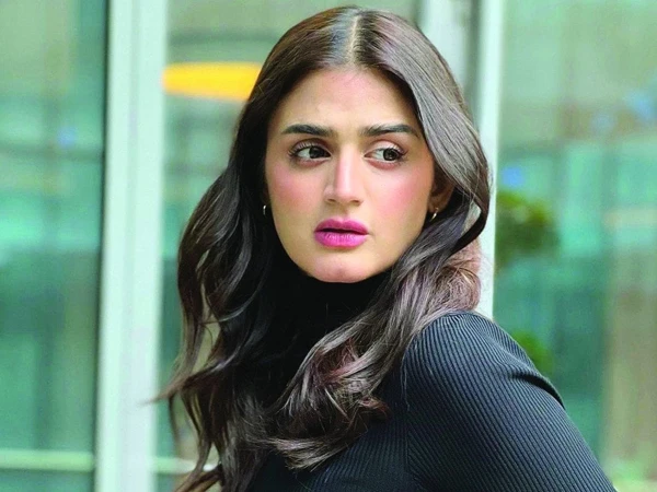 Pakistani actress Hira Mani attends an event in Toronto with a new bob hairstyle and black outfit.