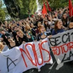 Students and workers protest rising living costs and housing problems in Italy.