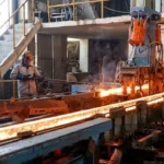 Balochistan's first digital steel mill operating in Quetta's Eastern Bypass Industrial Zone with automated machinery producing Grade 60 steel reinforcement bars.